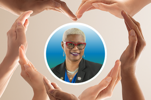 Many hands making the shape of a heart surrounding a headshot of AACRAO Board Member, Dr. Connie Shipman Newsome.