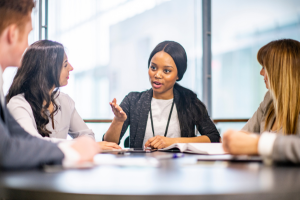 Photograph of professionals at a meeting.