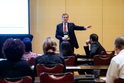 Male speaker addressing the audience in a breakout session.