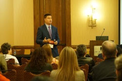 Male speaker addressing the audience in a breakout session.