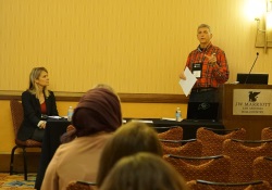 Male speaker addressing the audience in a breakout session.