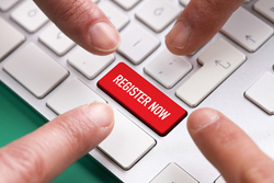 Photo of a keyboard with the enter key replaced by a red button that says "register now".