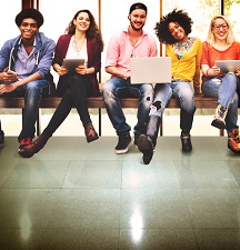 Group of young adults smiling at the camera.