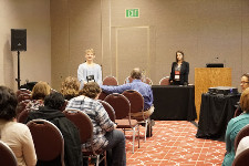 Photo of audience in a nondescript event space.