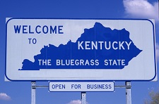 Photo of a "welcome to Kentucky" highway sign.